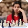 Woman looking at a chess board